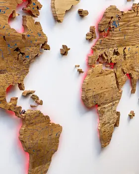 World map illuminated from solid oak