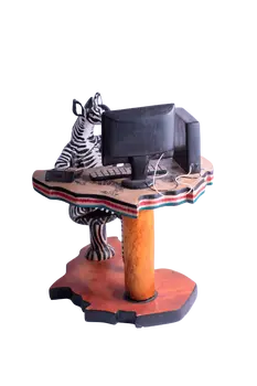 Wooden Zebra Sitting at Computer