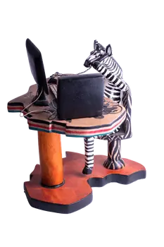 Wooden Zebra Sitting at Computer