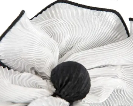 White & black racing fascinator by Max Alexander