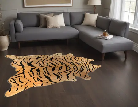 5' X 7' Black And Orange Cowhide Area Rug