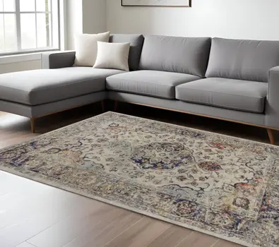 8' X 11' Ivory Blue And Orange Floral Medallion Area Rug