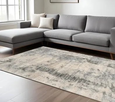 9' X 13' Ivory And Blue Abstract Area Rug