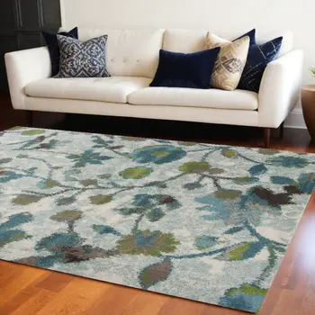 10' X 13' Teal Blue White And Green Floral Area Rug
