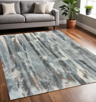 5' X 8' Teal Blue And White Abstract Area Rug