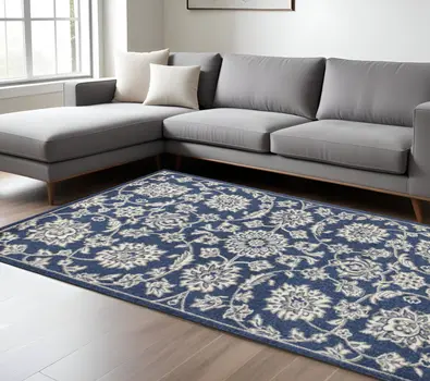 7' X 9' Denim Blue And Ivory Floral Area Rug