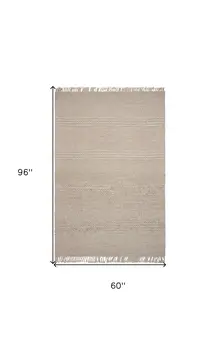 5' X 8' Beige Wool Hand Woven Area Rug With Fringe