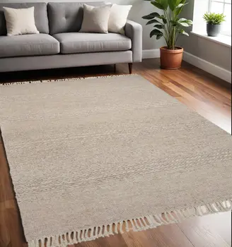 5' X 8' Beige Wool Hand Woven Area Rug With Fringe