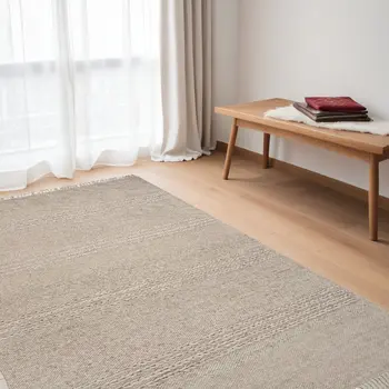 5' X 8' Beige Wool Hand Woven Area Rug With Fringe