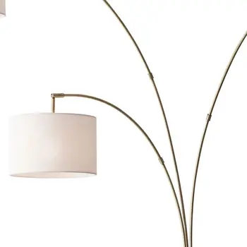74" Brass Three Light Arc Floor Lamp With Off White Fabric Drum Shade