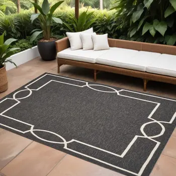 7' X 10' Onyx And White Geometric Handmade Indoor Outdoor Area Rug