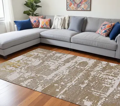 8' X 11' Ivory Taupe And Gold Abstract Area Rug