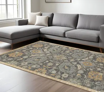7' X 10' Black Orange And Gray Wool Floral Area Rug