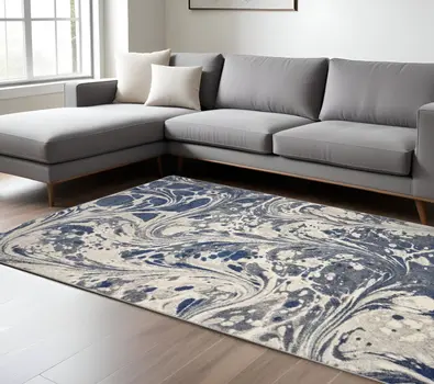 7' X 9' Ivory Blue And Gray Abstract Area Rug