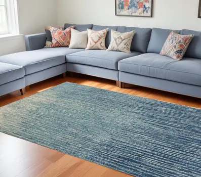 7' X 10' Blue And Ivory Abstract Area Rug