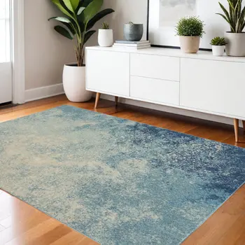 4' X 6' Blue And Ivory Abstract Area Rug