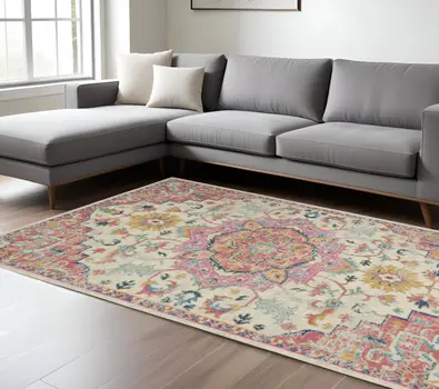 7' X 10' Pink And Ivory Southwestern Distressed Area Rug