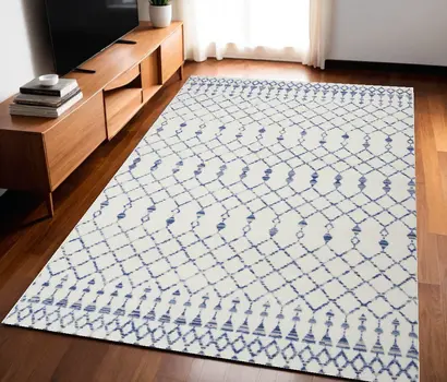 5' X 7' Ivory And Blue Geometric Area Rug