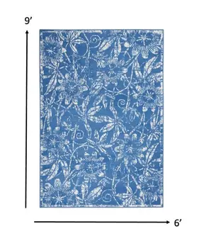 6' X 9' Blue And Ivory Floral Distressed Area Rug