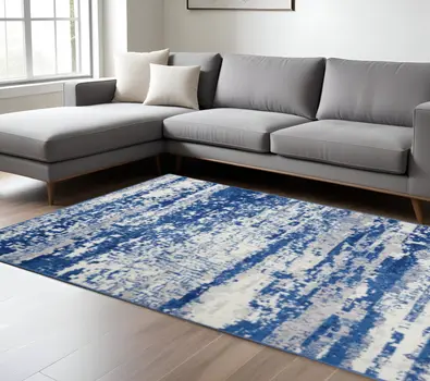 6' X 9' Ivory And Blue Ombre Distressed Area Rug
