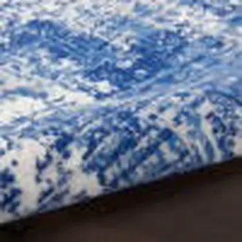 5' X 7' Blue And Ivory Abstract Distressed Area Rug