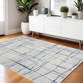 4' X 6' Ivory And Blue Geometric Distressed Area Rug