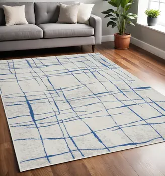 5' X 7' Ivory And Blue Geometric Distressed Area Rug