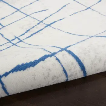 5' X 7' Ivory And Blue Geometric Distressed Area Rug
