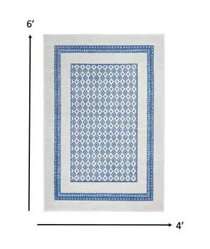 4' X 6' Ivory And Blue Geometric Area Rug
