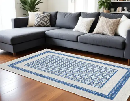 6' X 9' Ivory And Blue Geometric Area Rug