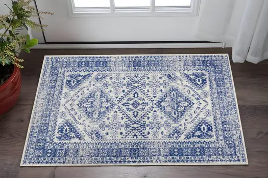6' X 9' Ivory And Blue Geometric Distressed Area Rug