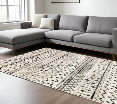 7' X 9' Ivory And Black Abstract Geometric Area Rug