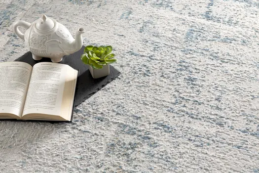5' X 7' Blue and Ivory Abstract Area Rug