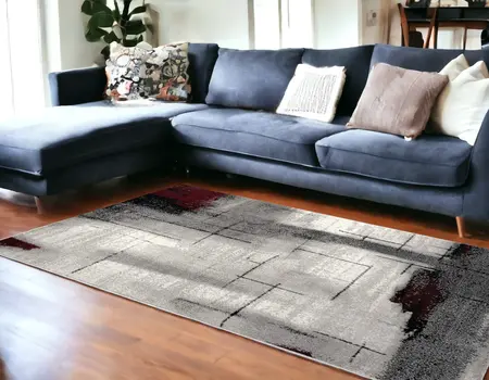 7' X 9' Gray And Burgundy Abstract Area Rug