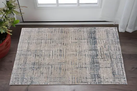 2' X 3' Cream Blue And Ivory Geometric Distressed Stain Resistant Area Rug