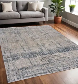 5' X 8' Cream Blue And Ivory Geometric Distressed Stain Resistant Area Rug