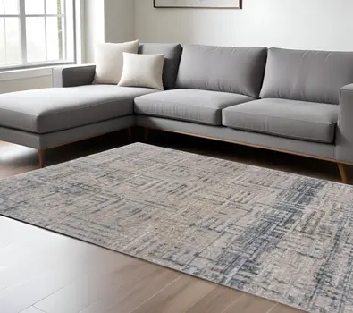 10' X 13' Cream Blue And Ivory Geometric Distressed Stain Resistant Area Rug