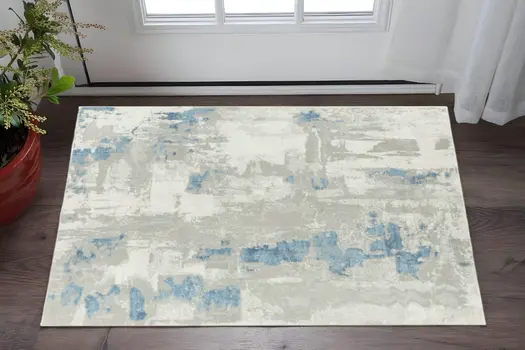 2' X 3' Ivory Gray And Blue Abstract Stain Resistant Area Rug