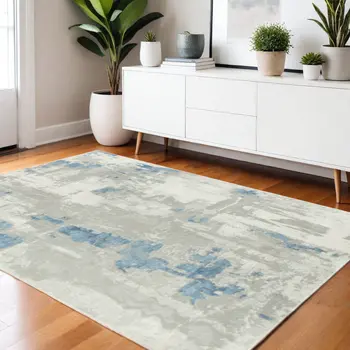 4' X 6' Ivory Gray And Blue Abstract Stain Resistant Area Rug