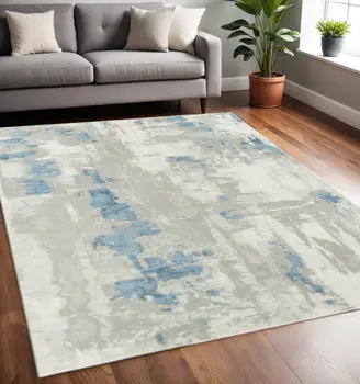 5' X 8' Ivory Gray And Blue Abstract Power Loom Stain Resistant Area Rug