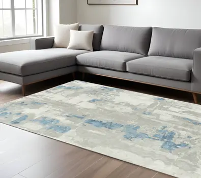 8' X 10' Ivory Gray And Blue Abstract Power Loom Stain Resistant Area Rug