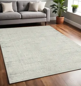 5' X 8' Ivory And Gray Floral Power Loom Distressed Stain Resistant Area Rug