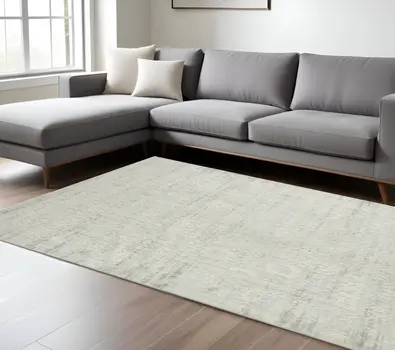 9' X 12' Ivory And Gray Floral Power Loom Distressed Stain Resistant Area Rug