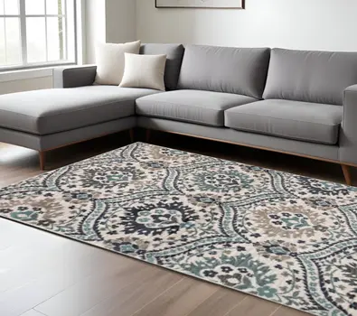 7' X 9' Ivory Blue And Gray Floral Stain Resistant Area Rug