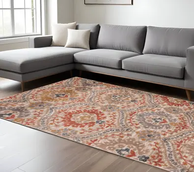 7' X 9' Ivory Orange And Gray Floral Stain Resistant Area Rug