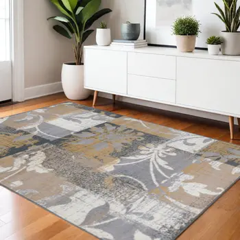 4' X 6' Beige And Gray Floral Power Loom Distressed Stain Resistant Area Rug