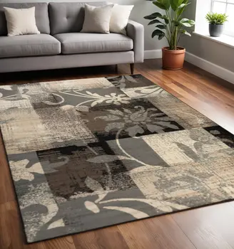 5' X 8' Beige And Gray Floral Power Loom Distressed Stain Resistant Area Rug