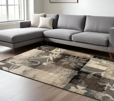 7' X 9' Beige And Gray Floral Power Loom Distressed Stain Resistant Area Rug
