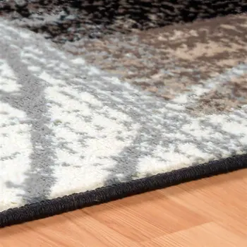 7' X 9' Beige And Gray Floral Power Loom Distressed Stain Resistant Area Rug