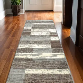 10' Light Blue And Ivory Patchwork Power Loom Stain Resistant Runner Rug